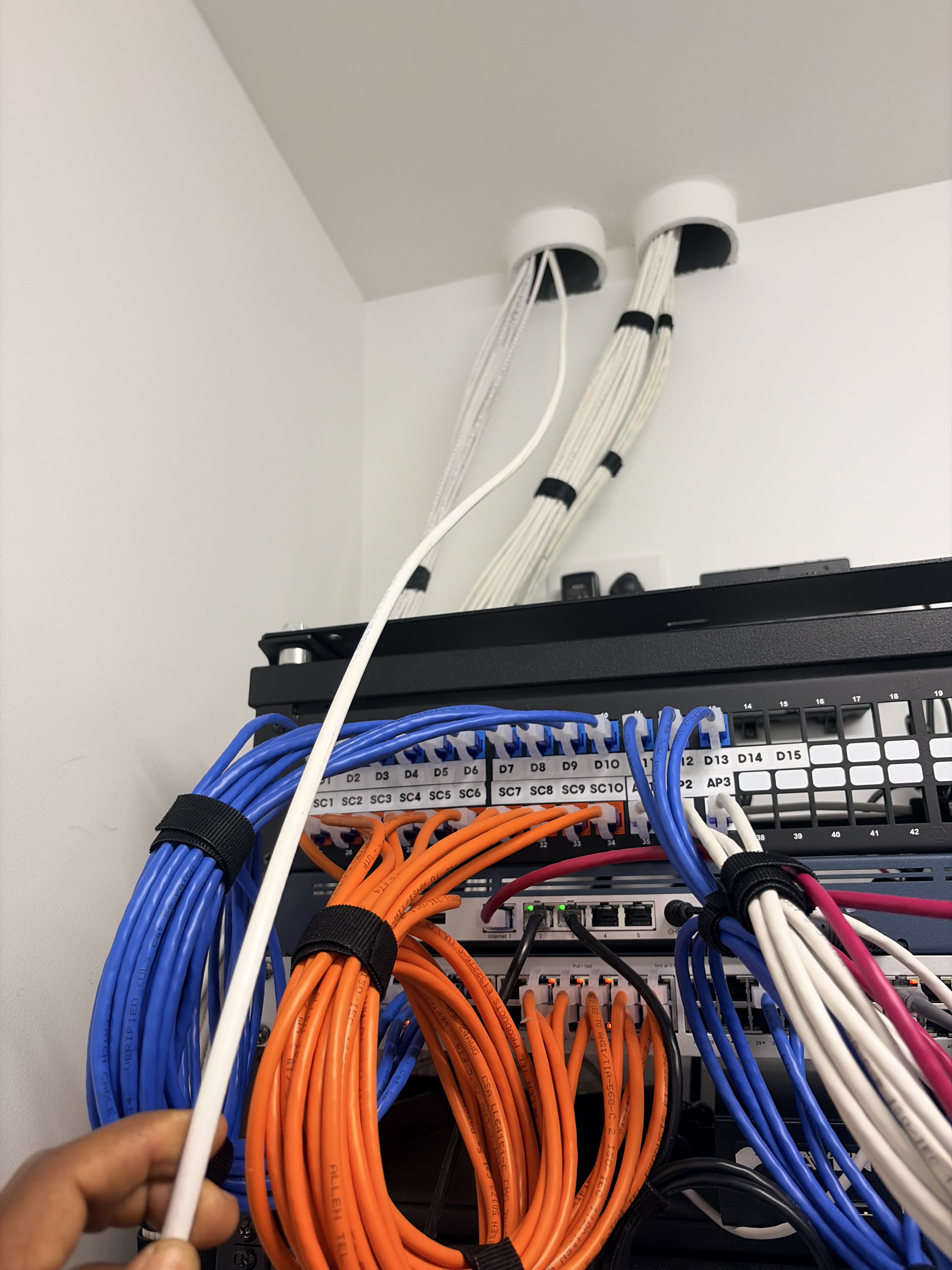 Organized structured cabling routed into a network rack